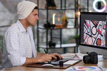 Poster - Professional retoucher working on computer in office
