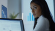 © Lumos Studio - Focused Young Latin Businesswoman Working on Computer in Modern Office – Perfect for Online Business, Market Analysis, and Tech Strategy Planning