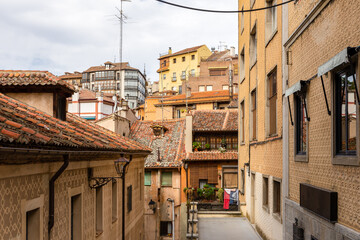 Segovia, Spain cityscape, traditonal Mediterranean style residential buildings with ornamental facades and tiled roofs.