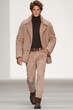 © Dina - Models presenting sophisticated outfits in Mocha Mousse Pantone PMS 17-1230 on the runway.