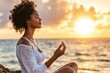 © MW - A young woman embraces calmness while enjoying a mindfulness moment near the ocean.