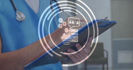 Poster - Image of business icons over caucasian female doctor taking notes