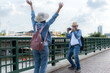 © Wosunan - Elderly couples travel on the old iron bridge (Phra Phutthayotfa Bridge) in Bangkok, Thailand