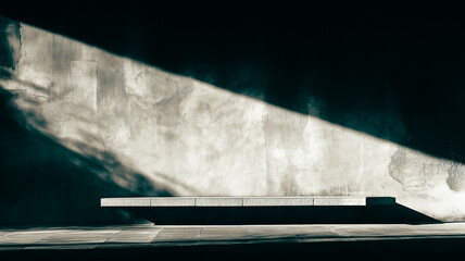 Poster - A dark room with a concrete floor and a large shadow cast on it. The shadow is long and stretches across the floor
