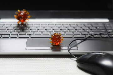 covid virus on a keyborad of a laptop