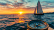 © Kingdola - Sailing Towards the Horizon: A compass sits atop a wooden surface, its needle pointing towards a sailboat gliding across the ocean as the sun sets in the distance.