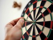 © Suparto - Arrow hitting the bullseye on a dartboard, showcasing success, accuracy, and detailed planning