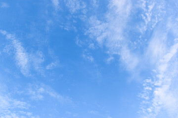 Wall Mural - beautiful blue sky and white fluffy group of clouds with sunrise in the morning, natural background