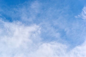 Wall Mural - beautiful blue sky and white fluffy group of clouds with sunrise in the morning, natural background