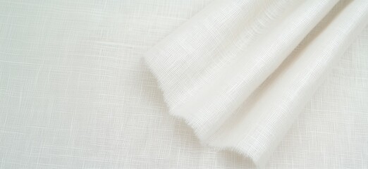 Poster - White textured fabric draping elegantly, showcasing fine weave and soft appearance. Ideal for upholstery, curtains, and fashion design., copy space for text
