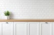 © trustmastertx - White kitchen cabinets with wood countertop and plant against white subway tile backsplash.