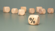 © Maks_Lab - A wooden percent symbol placed prominently on a flat surface for visual emphasis
