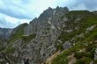 © bikemp - Austrian Alps - view of the peaks Elfer and tourist photographer from the footpath to Elfer in Stubai Alps