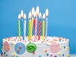 © Katherina - Colorful birthday cake with multiple lit candles, colorful, candles