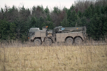 Wall Mural - British army MAN SVR (Support Vehicle Recovery) 8x8 Truck, moving along a dirt track