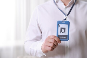 Wall Mural - Doctor with badge in hospital, closeup. Space for text