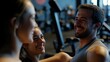 © Alla - A couple exercising together in a modern gym setting, showing teamwork and motivation