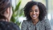 © Seak - Customer service representative handling a challenging situation with a calm and professional attitude, smiling while interacting with a client