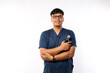 © ArvStd - Stethoscope in hand, standing. Male doctor wearing blue scrubs
