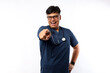 © ArvStd - Excited young asian male nurse or doctor pointing forward at camera, isolated over white background