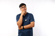 © ArvStd - Thoughtful smart asian male nurse in scrubs looking away and thinking,curious and confused gesture. Doctor have interesting idea, pondering over white background