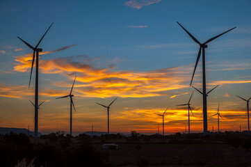 wind turbines at sunset. wind turbine in the sky. wind turbine against sky