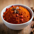© Hanan - Closeup of a bowl of red pepper spice Selected focus
