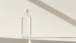© Olga - Minimalist mockup of a transparent bottle with Cap with a clean design on a soft background