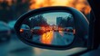© Heruu - City traffic jam reflected in car side mirror at sunset.