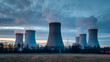 © Janos - A nuclear power plant with cooling towers under a cloudy sky during dusk.