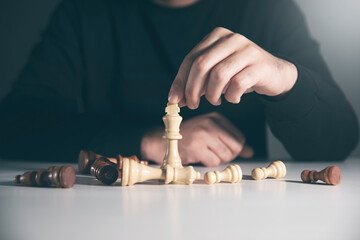 Wall Mural - hand of businessman playing chess game