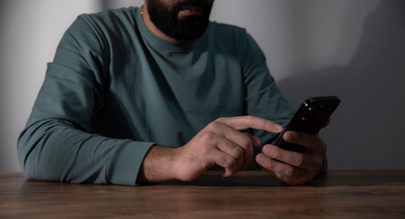 man holds the phone in his hand.
