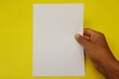 © Isman - hand holding a blank paper
