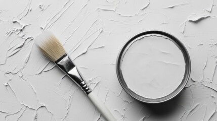 Aufkleber - Grey paint can with brush on textured white background showcasing strokes of paint in an artistic flat lay composition
