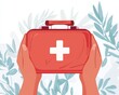 © Espresso - Hands of a person holding a red first aid kit against a soft, leafy background.