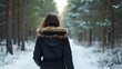 © RABBI - Woman in Black Winter Jacket Walking Snow-Covered Pine Forest Path - Winter Wonderland Scene