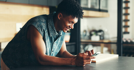 Poster - Smile, typing and man in kitchen with phone for social media meme, online chat or search on website. Smartphone, scroll and happy person in home with mobile app for communication, networking or text