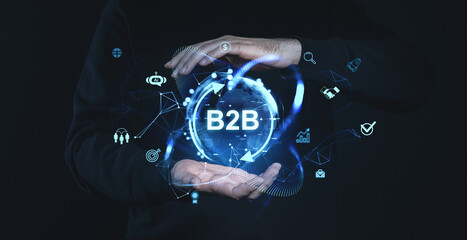 Poster - Futuristic B2B concept with digital icons and globe floating between hands on a dark background.