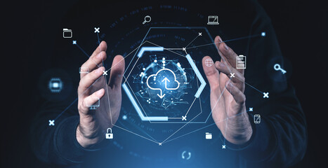 Poster - Cloud storage concept with hands interacting with a digital interface of icons and network connections in blue tones on a dark background.