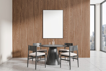 Sticker - Modern dining area with round table, chairs, and a blank vertical frame on wooden slatted wall in bright room with cityscape view. 3D Rendering