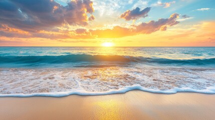Poster - As the sun descends on the horizon, golden rays dance upon the gentle waves of the blue sea. Soft clouds enhance the vivid colors, painting a breathtaking evening sky that invites peace