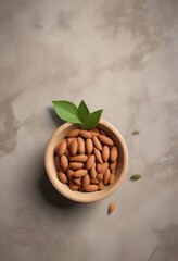 Wall Mural - Almond nut bowl with a single leaf on the side , metal, food