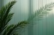 © Pete - Green palm plant casts shadow on reeded frosted glass panel. Abstract pattern of vertical ribbed texture creates modern stylish interior design. Refreshing summer vibe apparent through interplay of