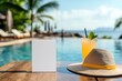 © fabioderby - Blank card, tropical drink and sun hat by the pool on exotic travel holiday