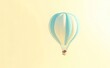 © NipaArts - Pastel blue and white hot air balloon floats in a pale yellow sky.