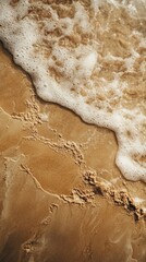 Poster - Soft mocha sand meets the whispering ocean waves at dawn, creating a serene atmosphere perfect for reflection or leisurely strolls along the coast