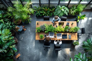 Poster - Aerial view of a team meeting in a lush, plant-filled office.