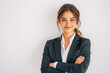 © 1005mm photography - Portrait of a business smiling European woman about 30 years old in a business suit on a bright background in the studio