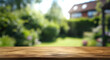 © TAMER YILMAZ - Empty wood table top on blur abstract green from garden and house background