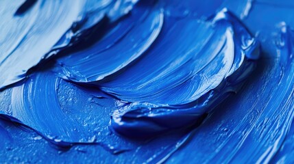Poster - Textured close-up of vibrant blue paint swirls on a canvas highlighting artistic expression and creativity in contemporary art.